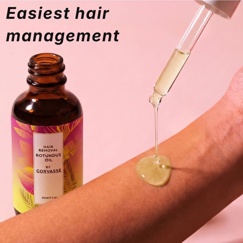 Dropper releasing Corvasse oil onto a forearm for easy hair management